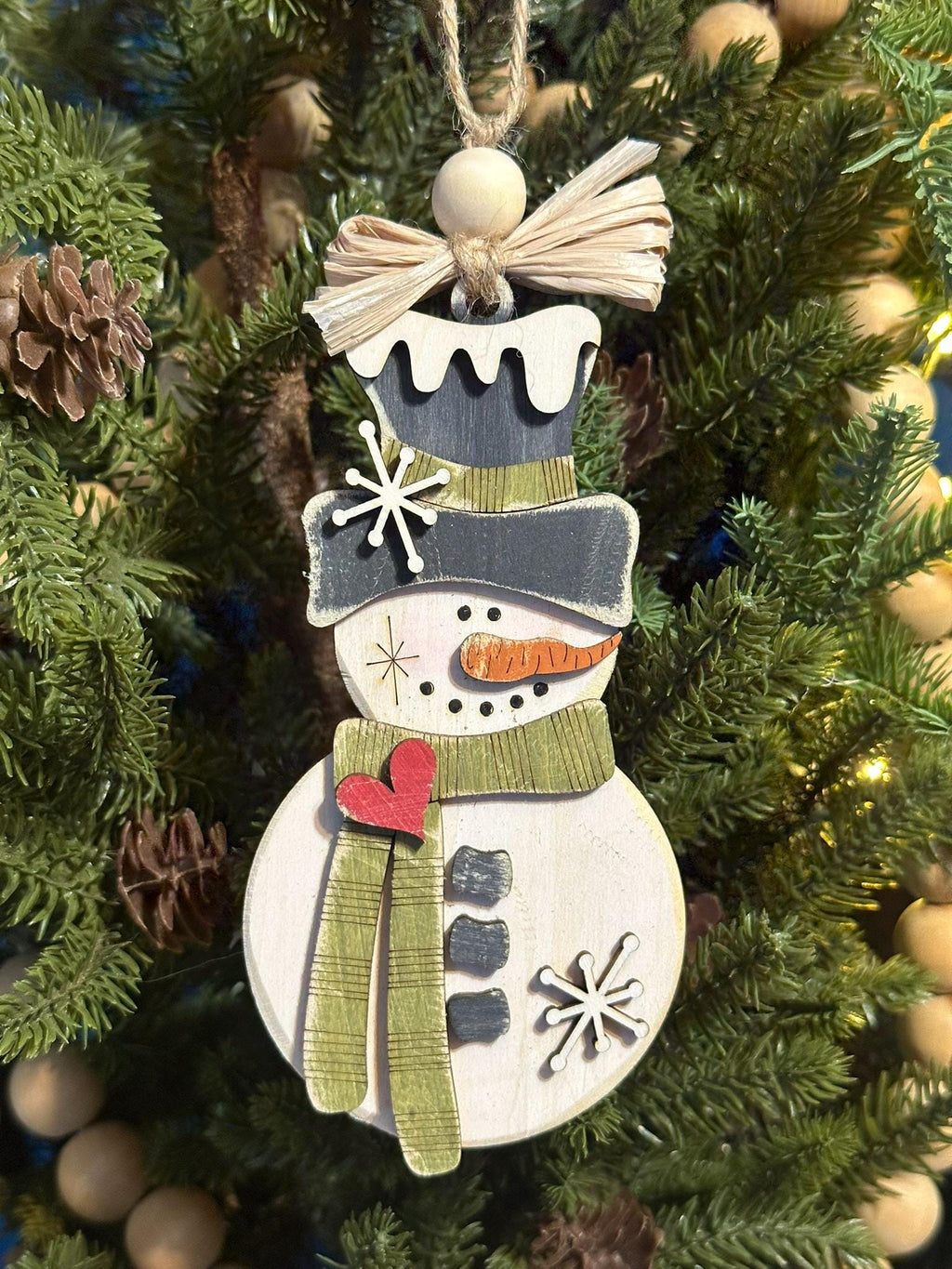 rustic snowman ornament with green scarf and raffia bow