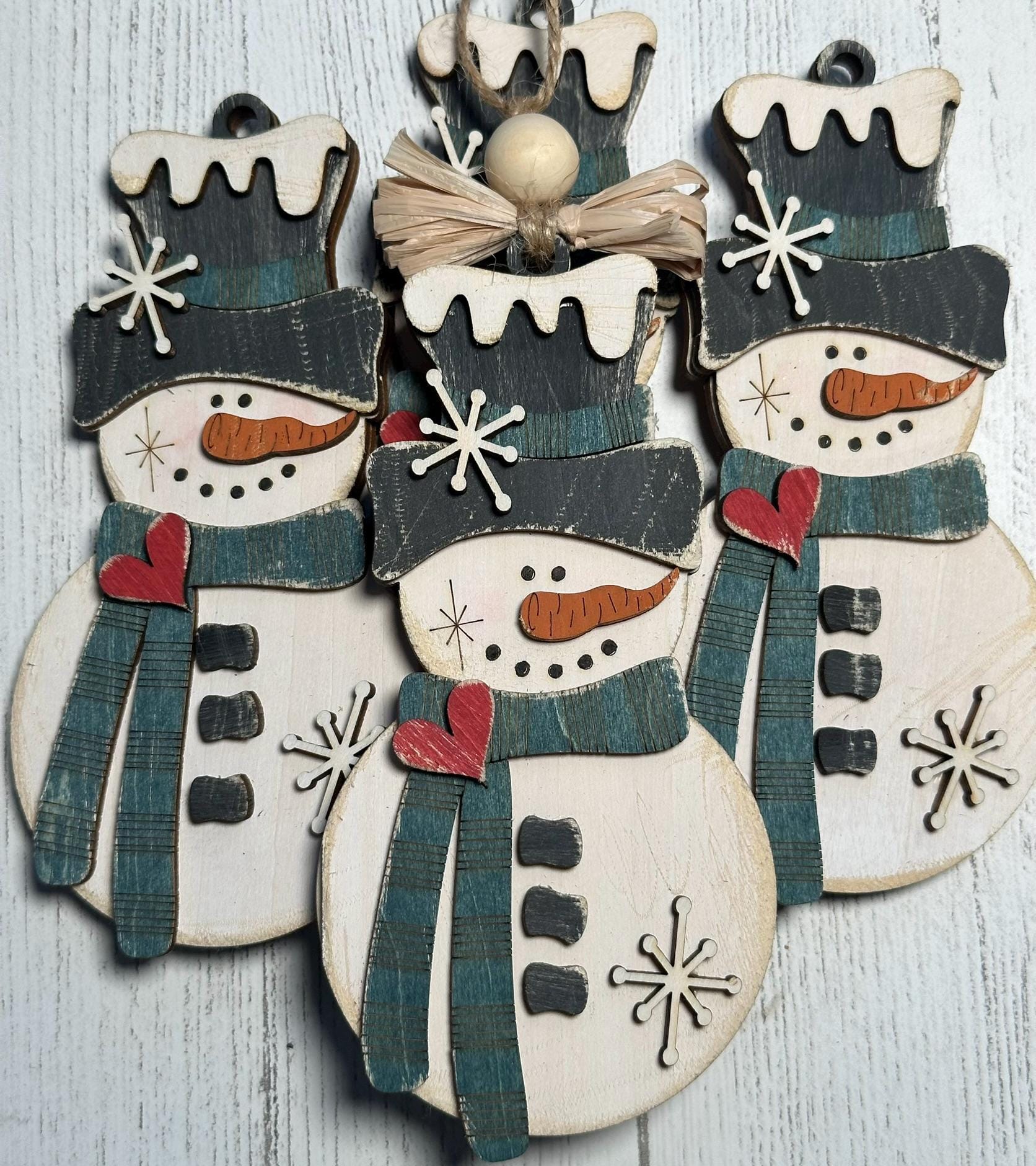 4 rustic snowman ornaments with blue scarf and raffia bow